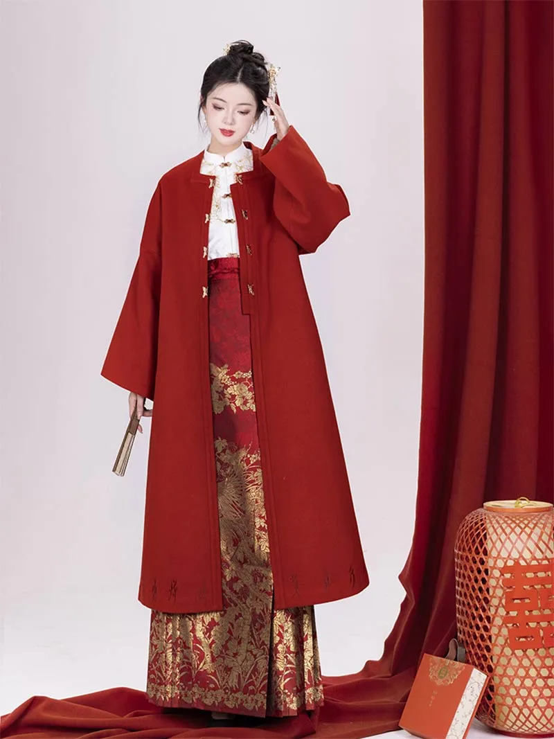 Red woven brocade mamian skirt with Ming-style cloud-shoulder hanfu, traditional Chinese festive dress for wedding toasts and New Year celebrations.