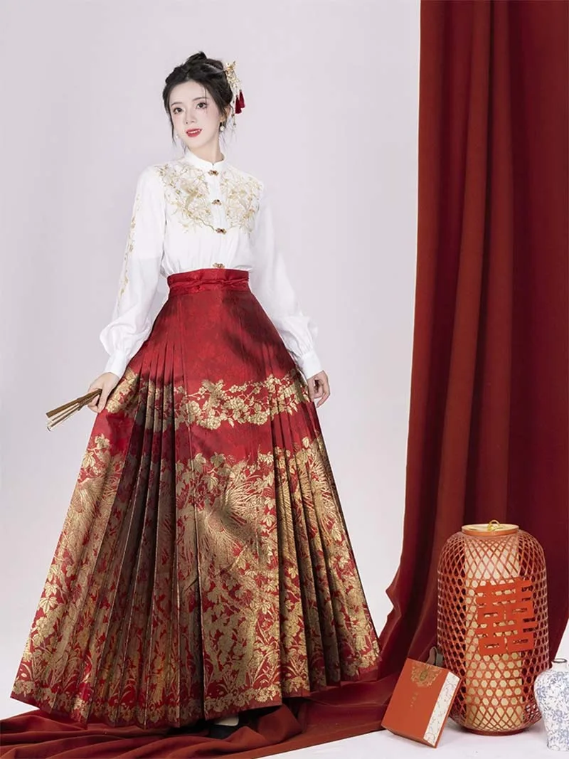 Red woven brocade mamian skirt with Ming-style cloud-shoulder hanfu, traditional Chinese festive dress for wedding toasts and New Year celebrations.