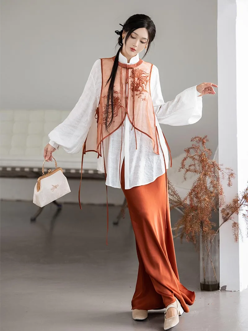Modernised hanfu with embroidered vest, mandarin collar shirt, and fishtail skirt in orange autumn style