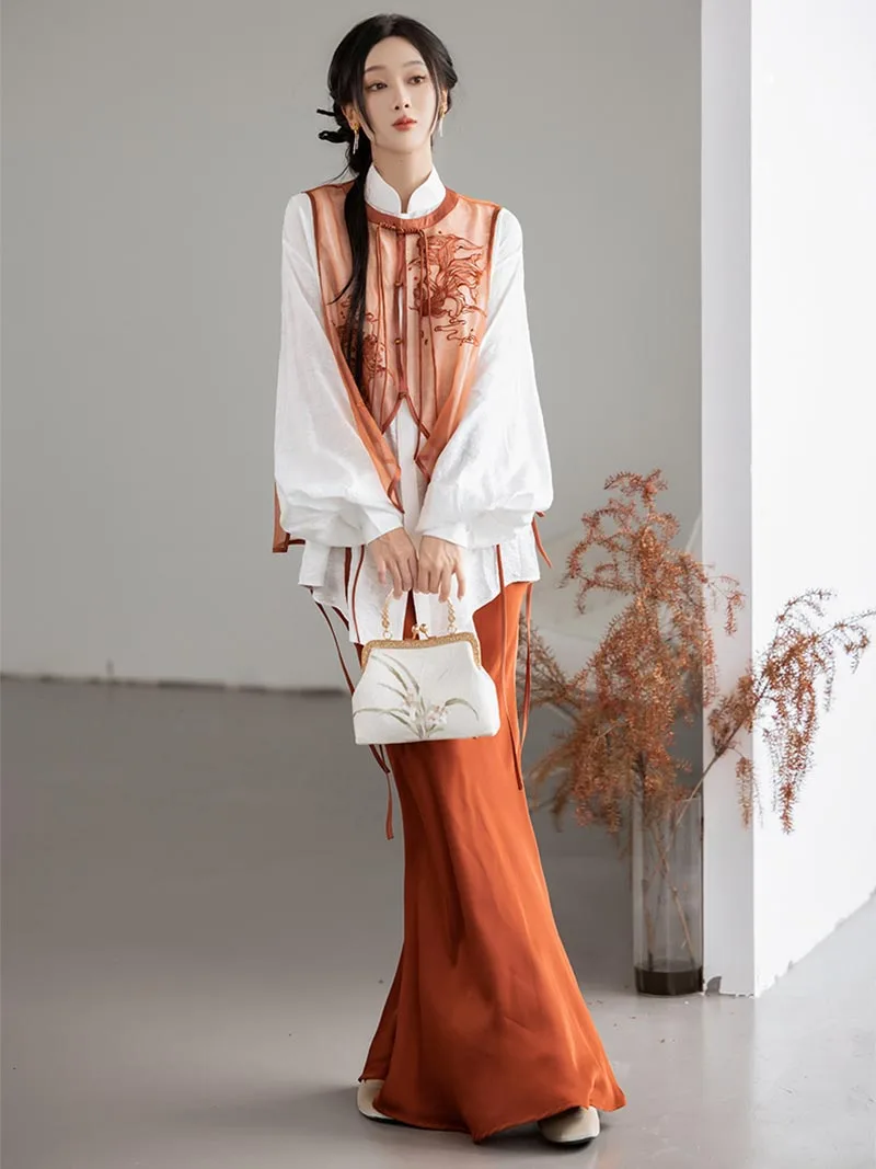 Modernised hanfu with embroidered vest, mandarin collar shirt, and fishtail skirt in orange autumn style