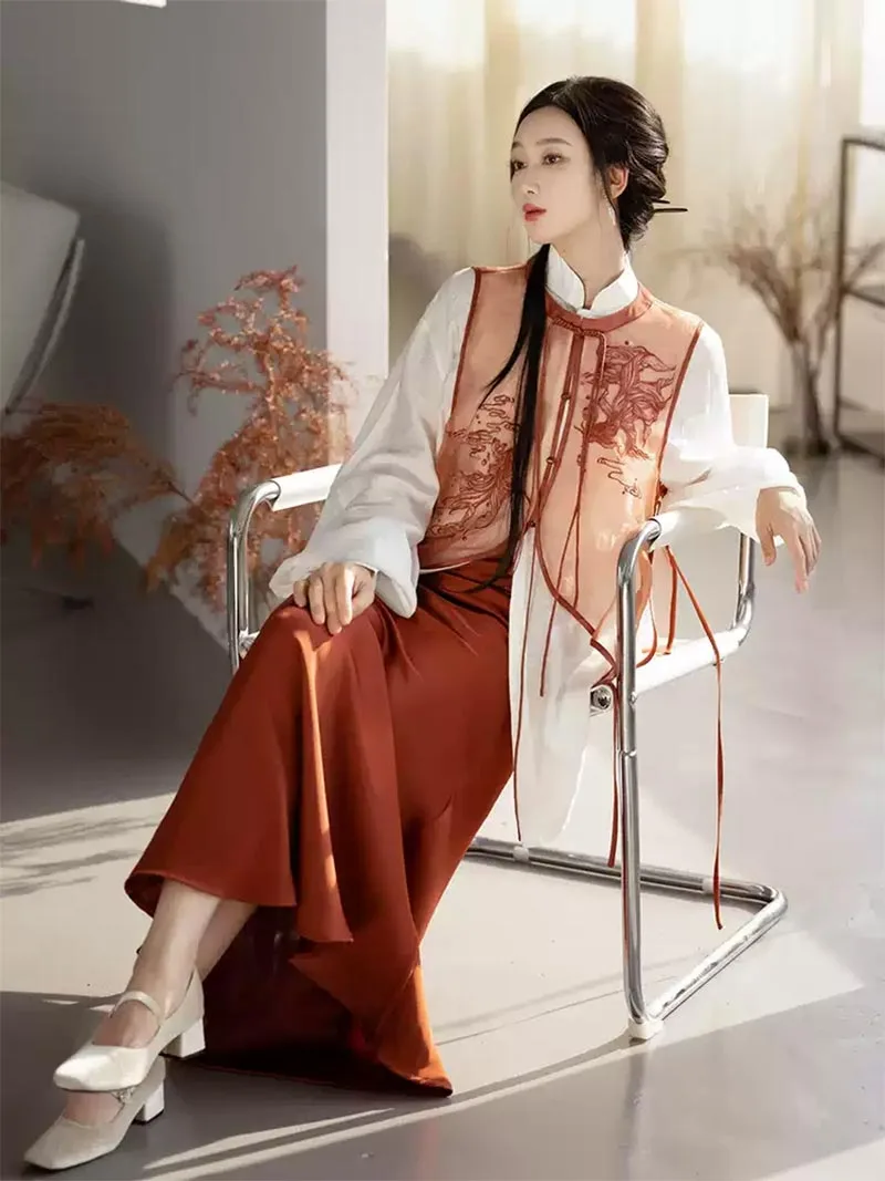 Modernised hanfu with embroidered vest, mandarin collar shirt, and fishtail skirt in orange autumn style