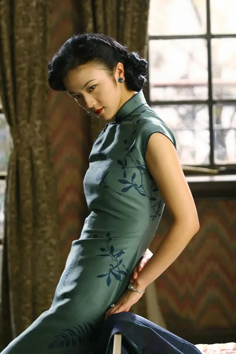 Elegant Chinese qipao dress featuring traditional embroidery and a graceful silhouette, symbolizing timeless oriental beauty.