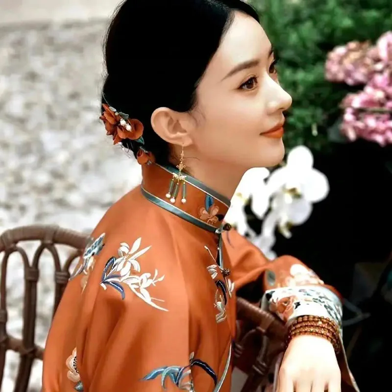 Elegant Chinese qipao dress featuring traditional embroidery and a graceful silhouette, symbolizing timeless oriental beauty.