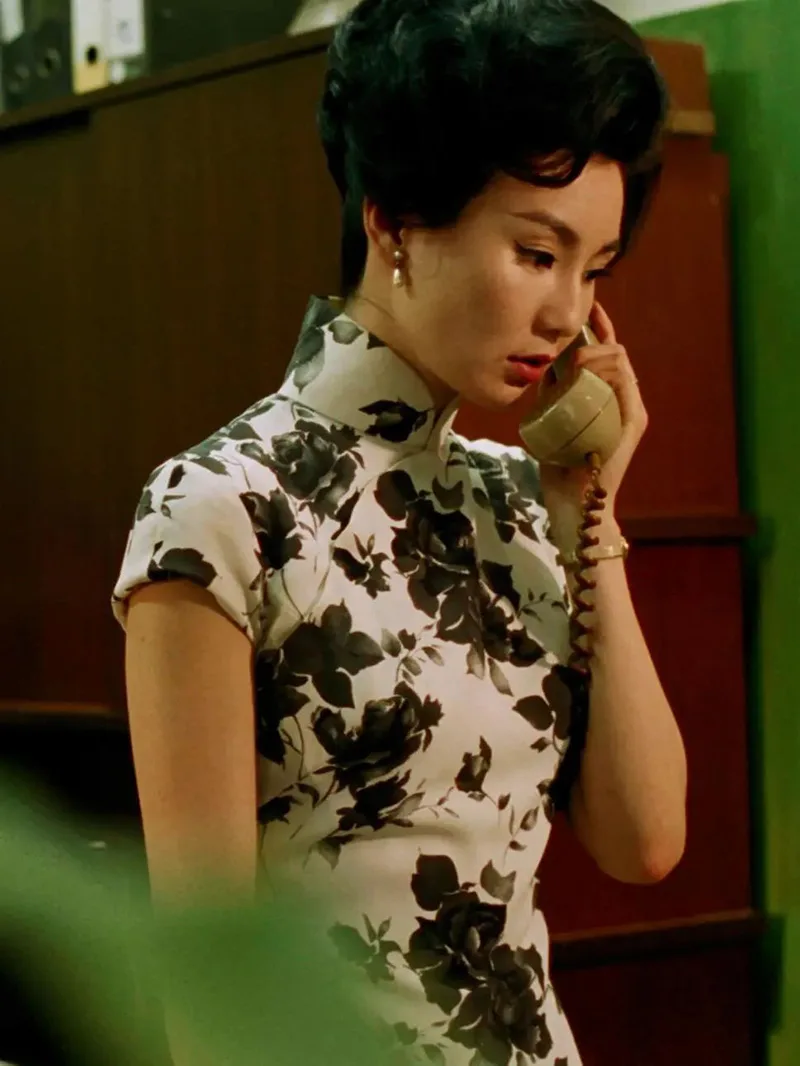 Elegant Chinese qipao dress featuring traditional embroidery and a graceful silhouette, symbolizing timeless oriental beauty.