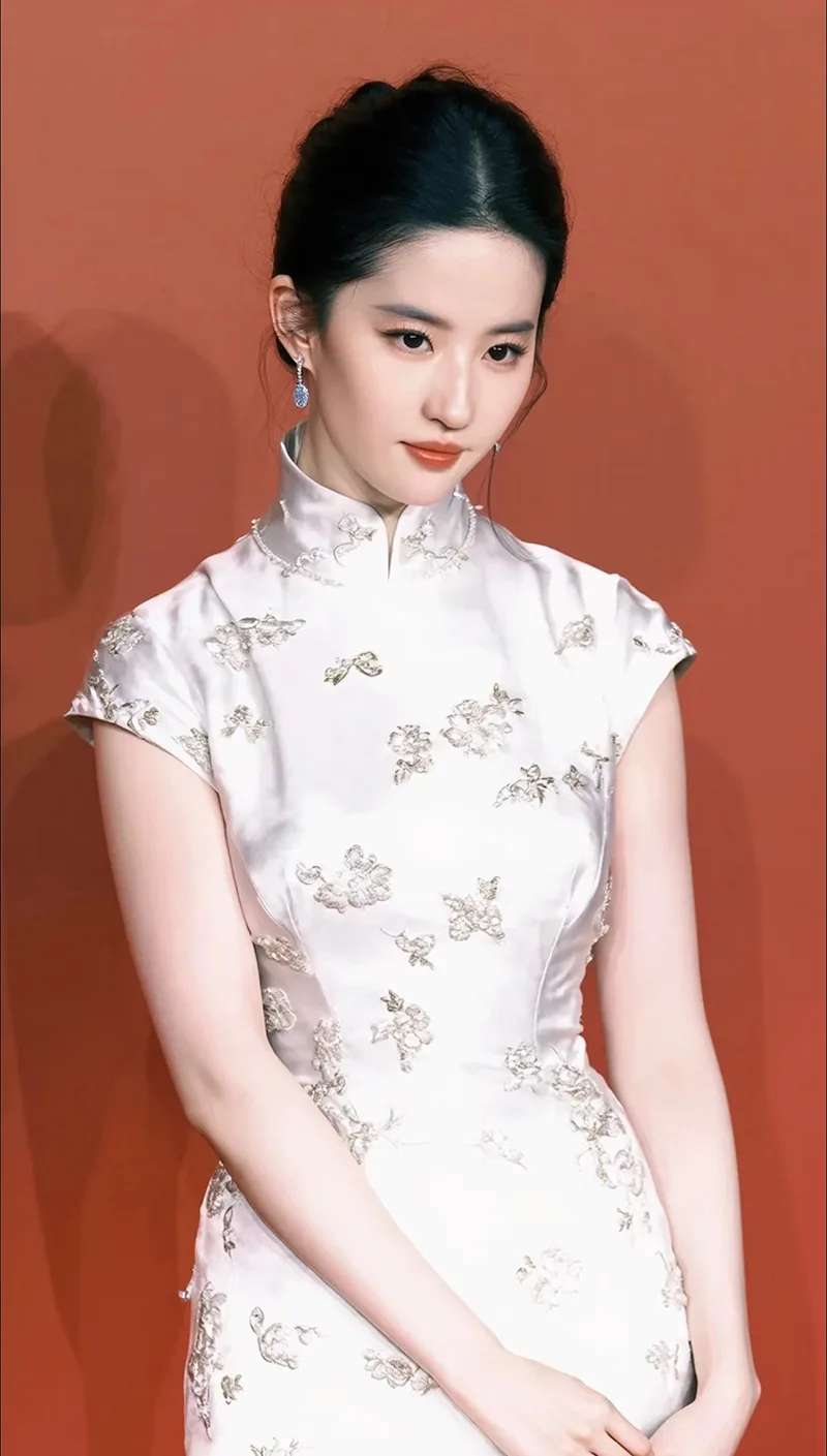 Elegant Chinese qipao dress featuring traditional embroidery and a graceful silhouette, symbolizing timeless oriental beauty.