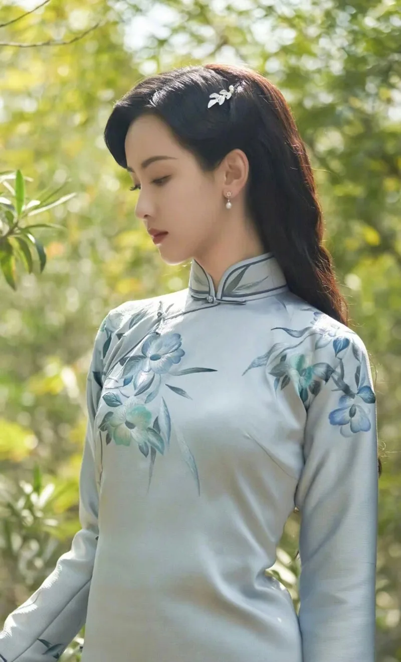 Elegant Chinese qipao dress featuring traditional embroidery and a graceful silhouette, symbolizing timeless oriental beauty.