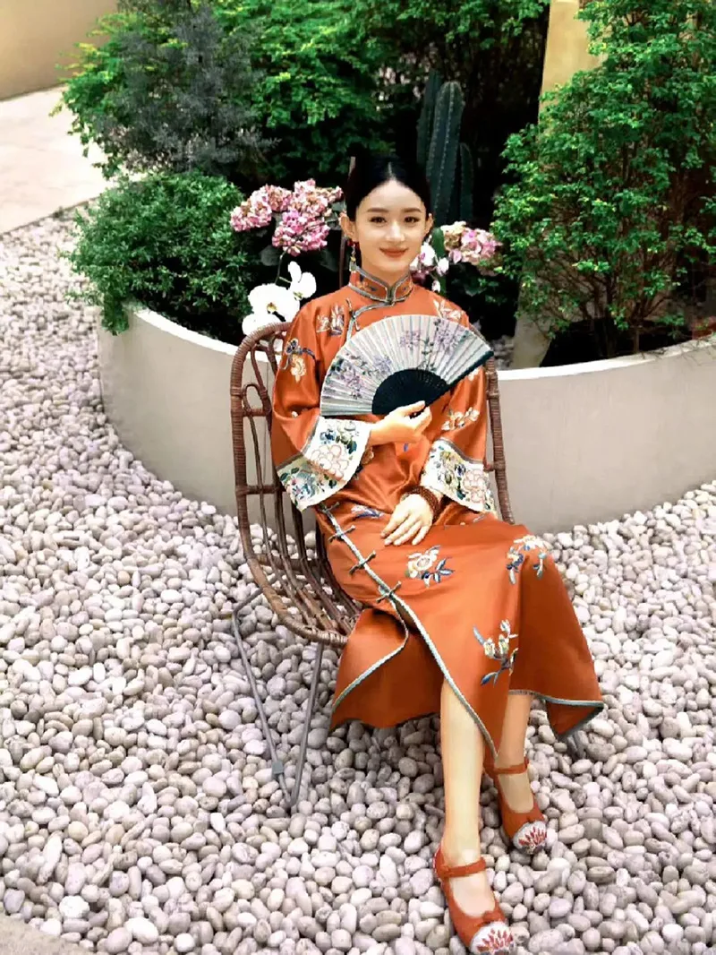 Elegant Chinese qipao dress featuring traditional embroidery and a graceful silhouette, symbolizing timeless oriental beauty.
