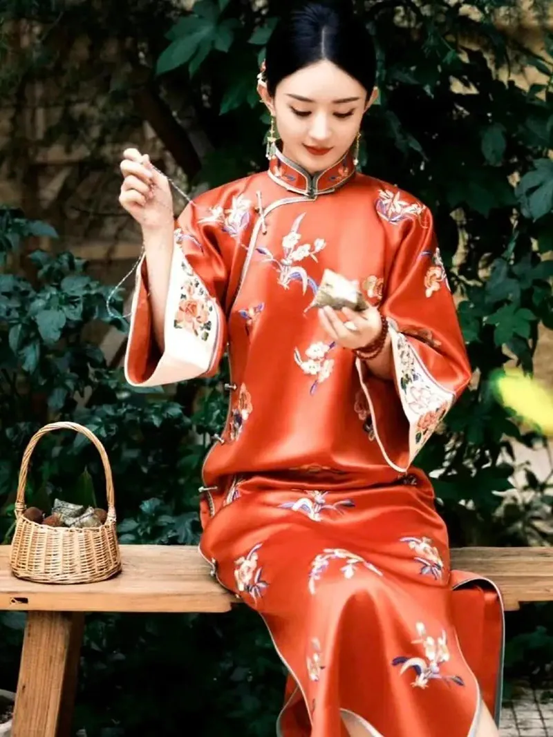 Elegant Chinese qipao dress featuring traditional embroidery and a graceful silhouette, symbolizing timeless oriental beauty.