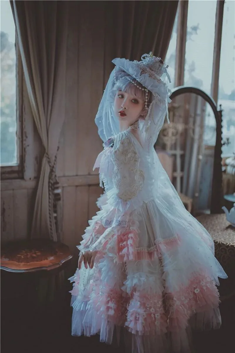 Beautiful Lolita dress featuring lace, ruffles, and bow details, showcasing a sweet and elegant princess style.