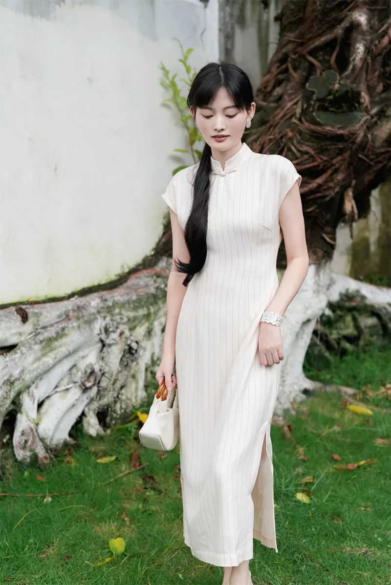 Elegant Chinese qipao dress with traditional embroidery, showcasing classic Asian fashion and cultural heritage.