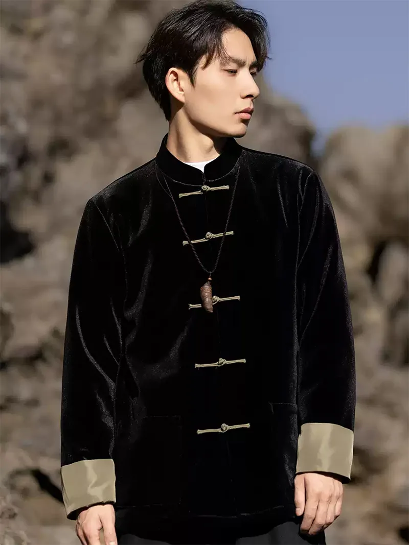 Black Tang suit for men featuring velvet fabric, frog buttons, and loose-fit Chinese traditional jacket design for spring or festive occasions.