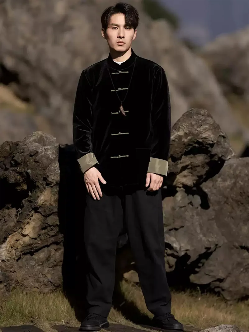 Black Tang suit for men featuring velvet fabric, frog buttons, and loose-fit Chinese traditional jacket design for spring or festive occasions.