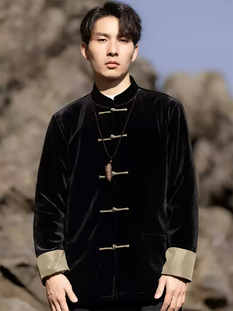 Black Tang suit for men featuring velvet fabric, frog buttons, and loose-fit Chinese traditional jacket design for spring or festive occasions.