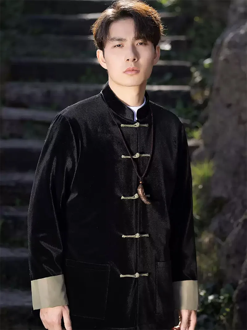 Black Tang suit for men featuring velvet fabric, frog buttons, and loose-fit Chinese traditional jacket design for spring or festive occasions.