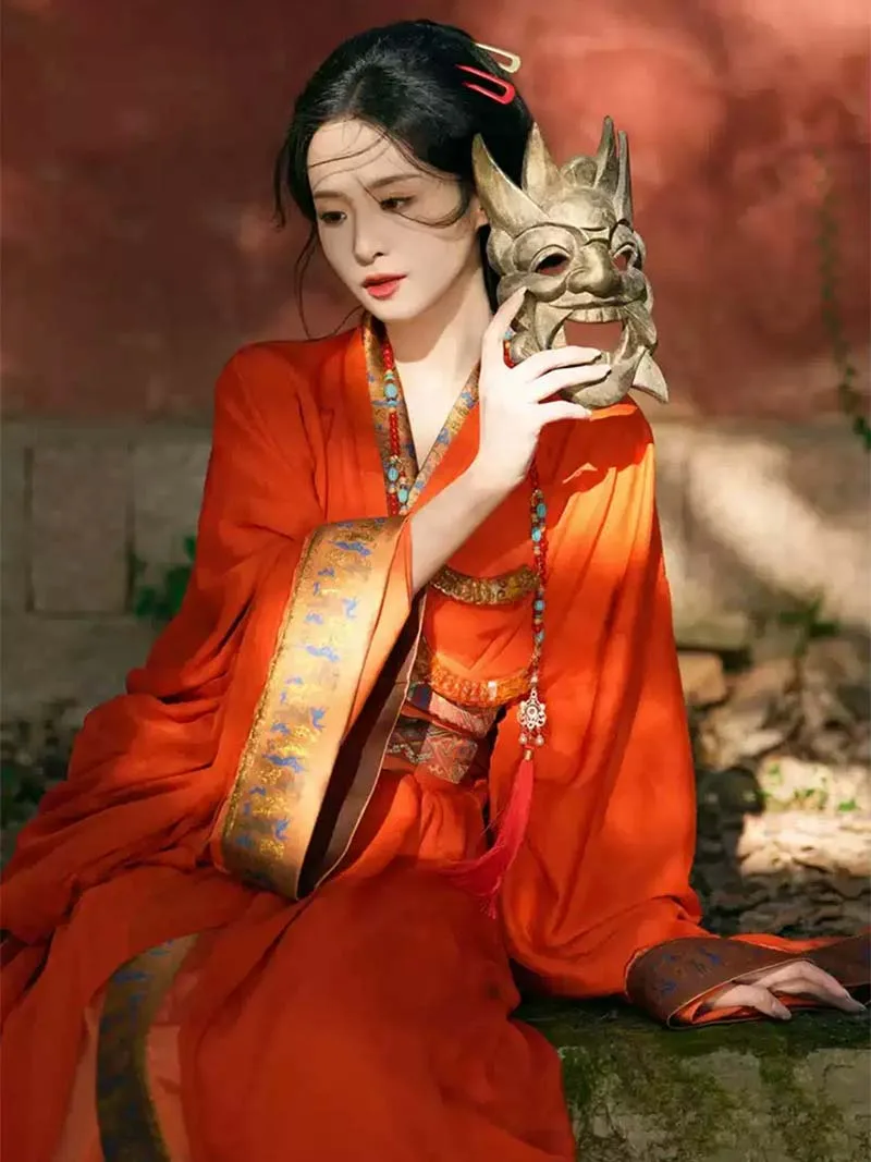 Red Chinese hanfu dress with trailing hem inspired by Warring States robe, featuring wide sleeves and traditional elegance