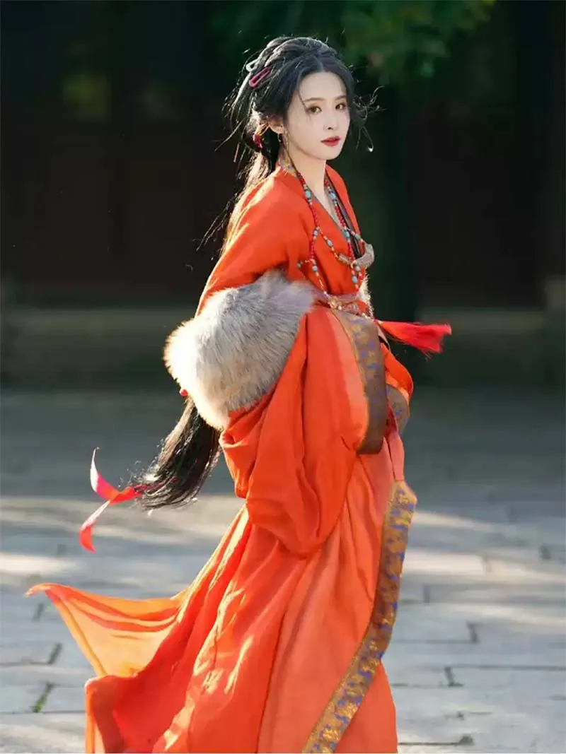 Red Chinese hanfu dress with trailing hem inspired by Warring States robe, featuring wide sleeves and traditional elegance