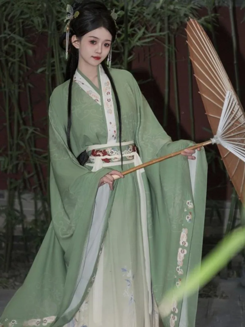 Elegant green hanfu dress with wide sleeves, flowing ancient Chinese style gown for women inspired by traditional beauty