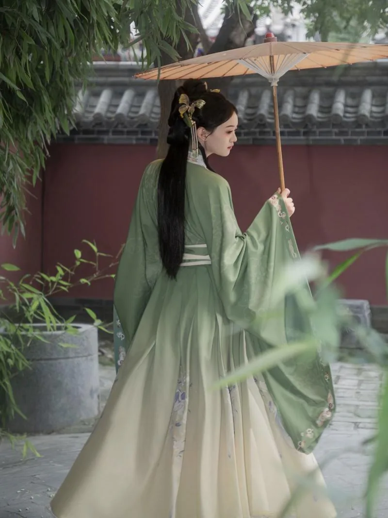 Elegant green hanfu dress with wide sleeves, flowing ancient Chinese style gown for women inspired by traditional beauty