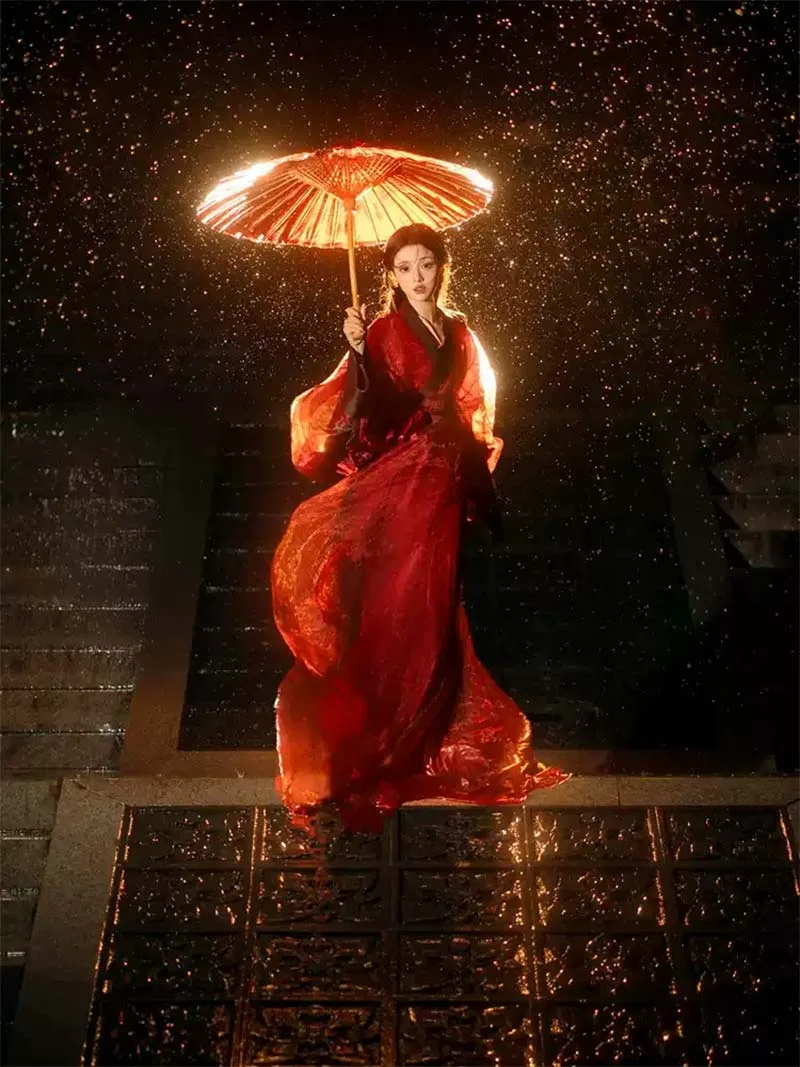 Red Hanfu dresses inspired by Warring States style with wide sleeves and straight hem for winter performances and cultural events