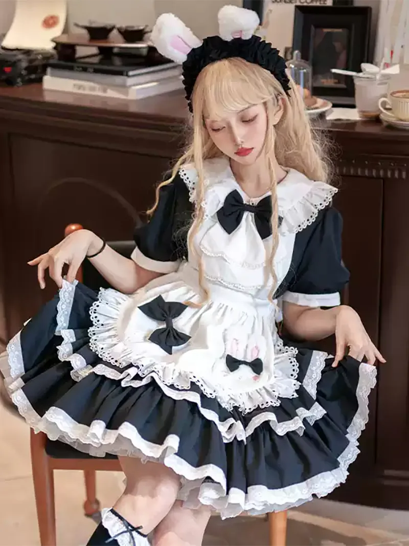 Classic black and white Lolita maid dress with lace apron and bow details, elegant original design
