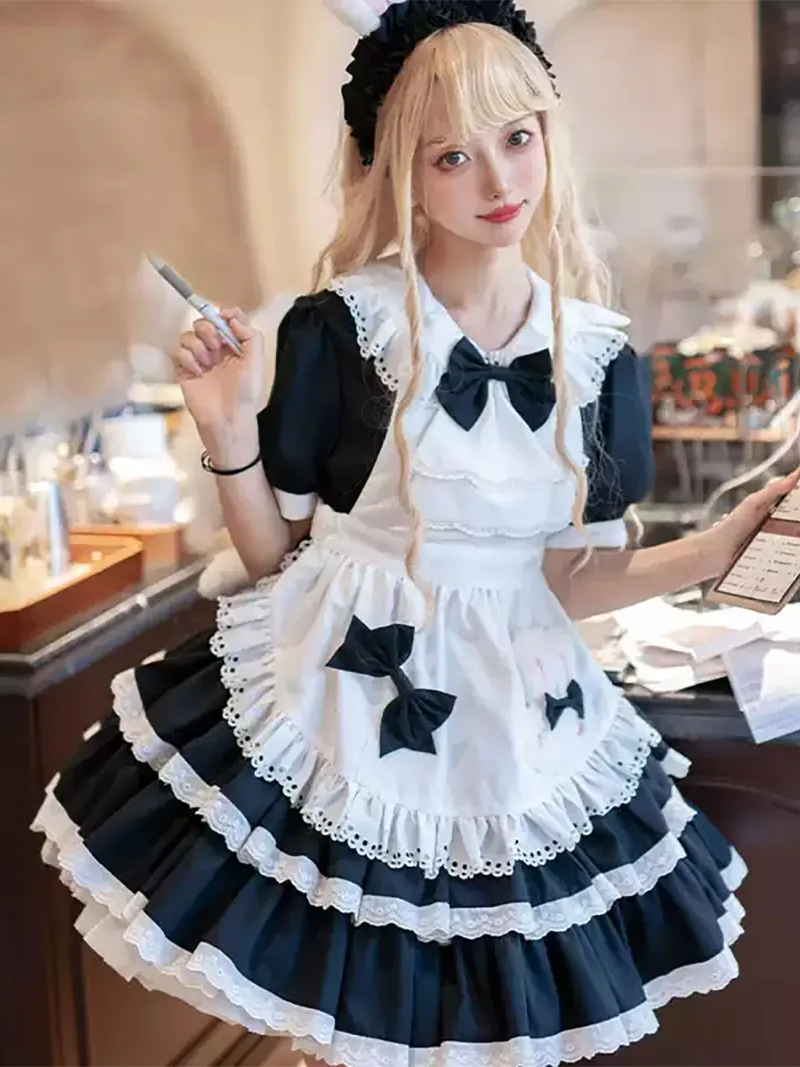 Classic black and white Lolita maid dress with lace apron and bow details, elegant original design