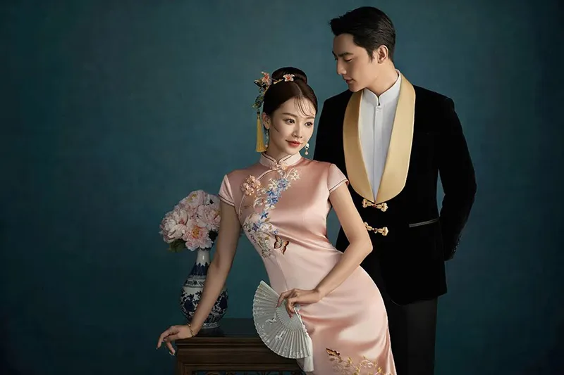 Qipao elegance captured in soft light, revealing the timeless grace of Chinese femininity.