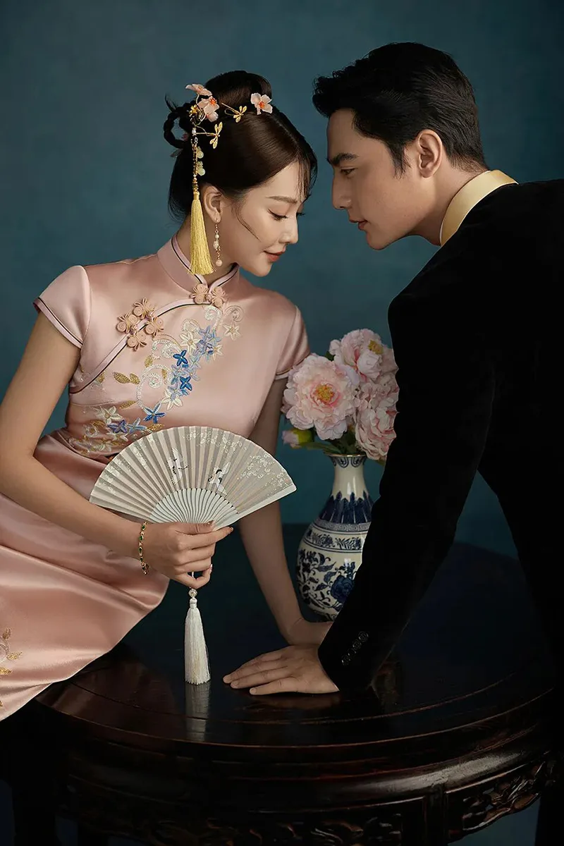 Qipao elegance captured in soft light, revealing the timeless grace of Chinese femininity.