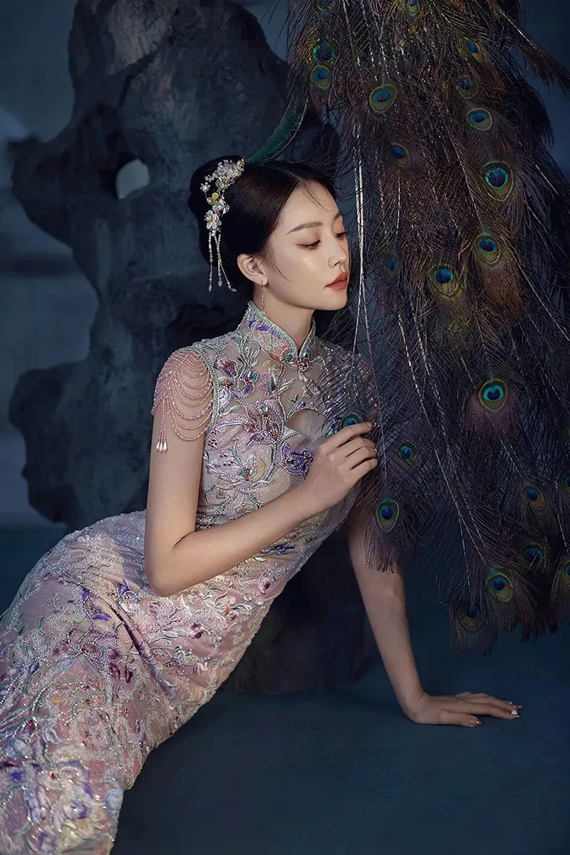 Qipao elegance captured in soft light, revealing the timeless grace of Chinese femininity.