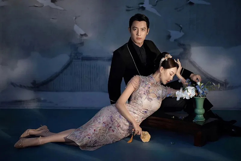 Qipao elegance captured in soft light, revealing the timeless grace of Chinese femininity.