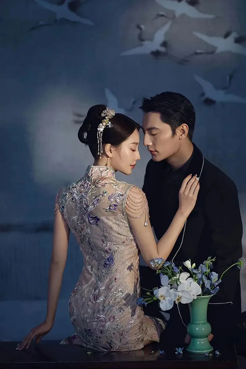Qipao elegance captured in soft light, revealing the timeless grace of Chinese femininity.