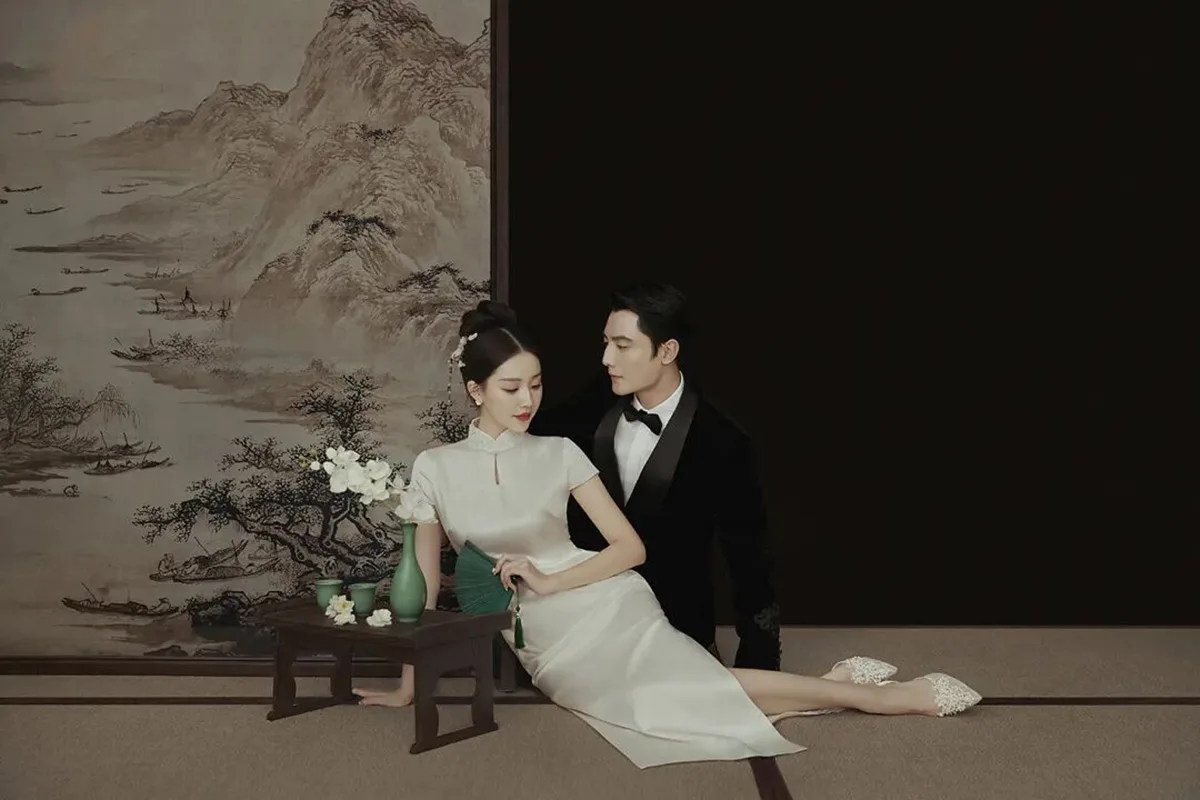 Qipao elegance captured in soft light, revealing the timeless grace of Chinese femininity.