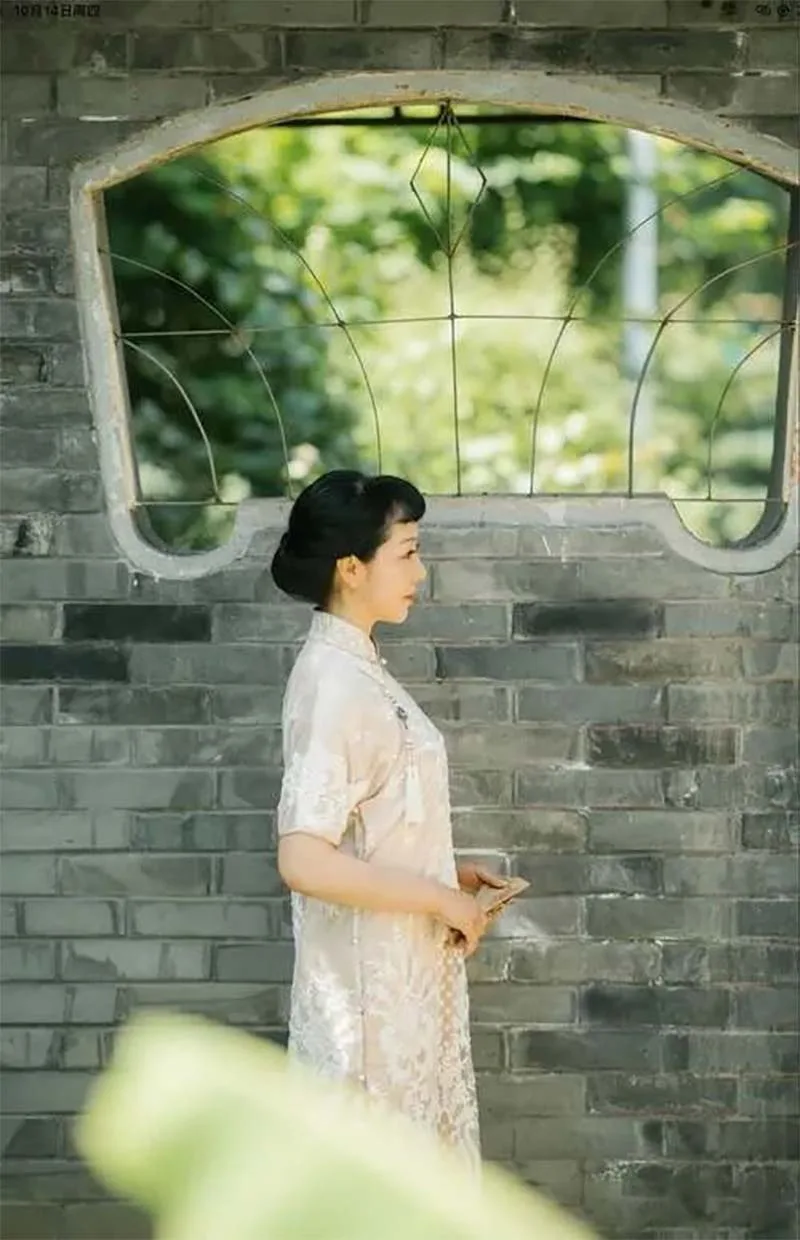 Elegant woman wearing a traditional qipao dress, illustrating cultural taboos to avoid
