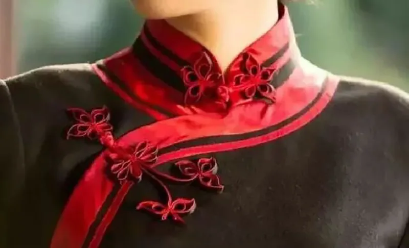 What Is A Tang Suit — traditional Chinese jacket with mandarin collar and frog buttons symbolizing elegance and culture