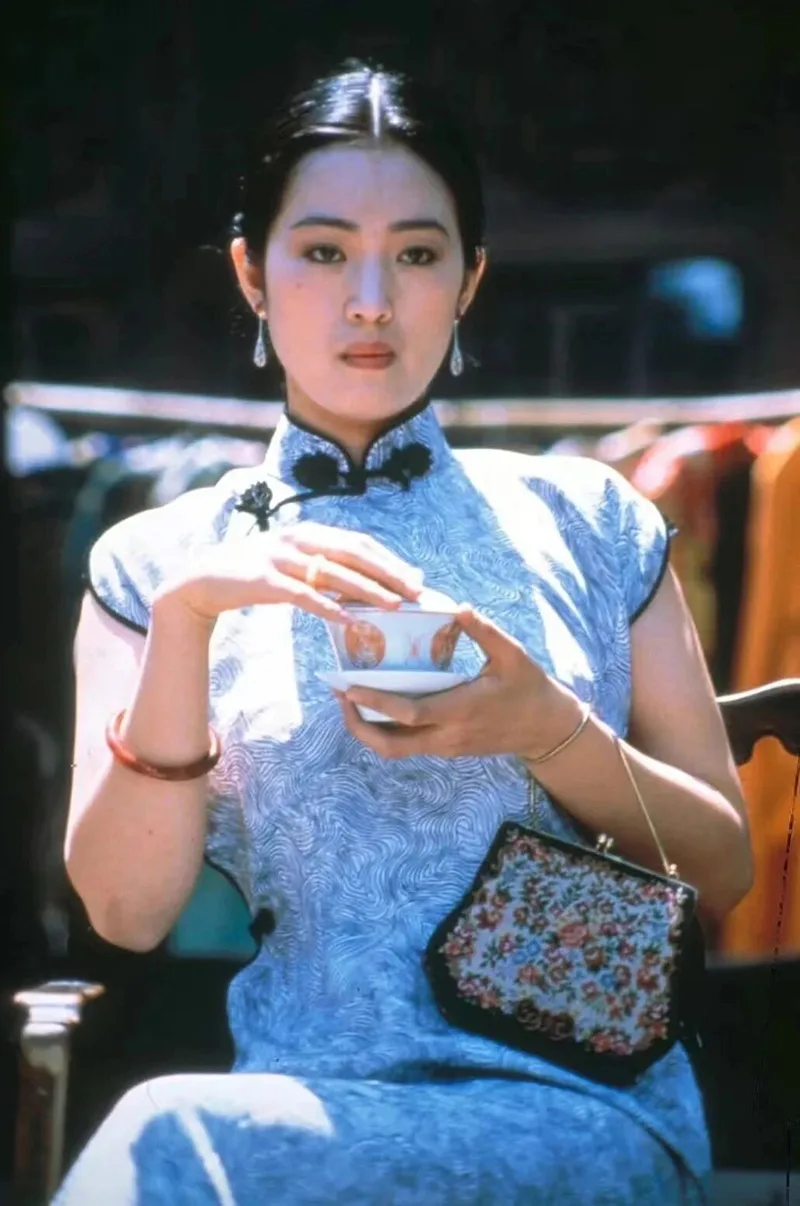 Woman qipao expressing traditional Chinese elegance and cultural heritage.